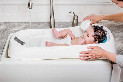 Move your body around on top of the ball to massage your back muscles. . Four moms bathtub
